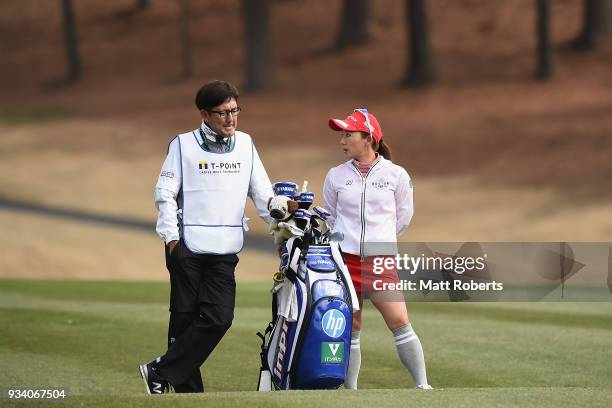 Chie Arimura of Japan prepares to play her second shot on the 1st hole during the final round of the T-Point Ladies Golf Tournament at the Ibaraki...