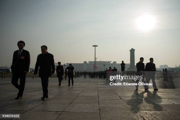 Delegates arrive to attend the seventh plenary session of the 13th National People's Congress at the Great Hall of the People on March 19, 2018 in...