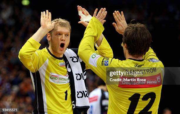 Johannes Bitter , goalkeeper of Hamburg celebrates with team mate Per Sandstroem during the Bundesliga match between HSV Hamburg and TSV Dormagen at...