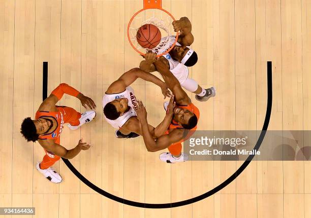Horace Spencer of the Auburn Tigers dunks the ball over Aamir Simms of Clemson during the second round of the 2018 NCAA Men's Basketball Tournament...