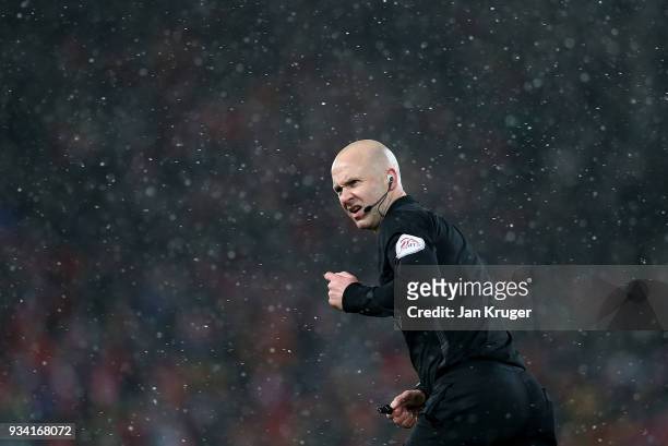 Referee Anthony Taylor in action during the Premier League match between Liverpool and Watford at Anfield on March 17, 2018 in Liverpool, England.