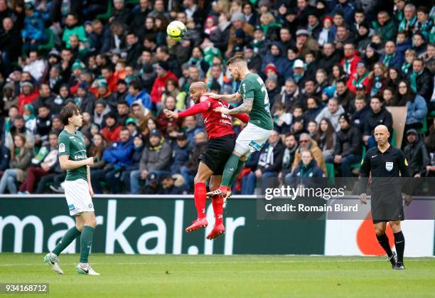 Briand Jimmy of Guingamp and Debuchy Mathieu of Saint Etienne and Selnaes Ole kristian of Saint Etienne and Delerue Amaury referee during the Ligue 1...