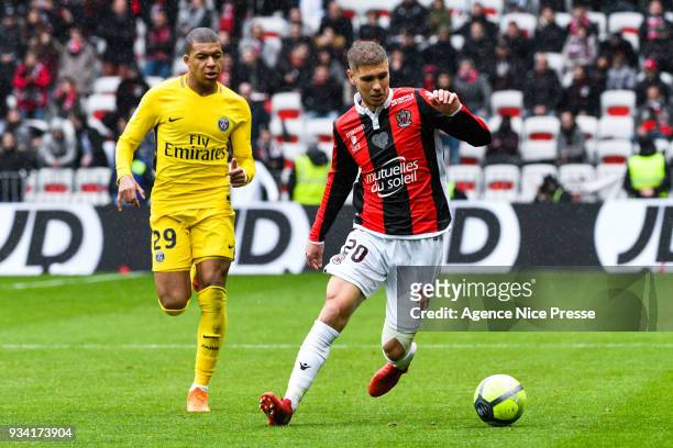 Maxime Le Marchand of Nice and Kylian Mbappe of PSG during the Ligue 1 match between OGC Nice and Paris Saint Germain at Allianz Riviera on March 18,...