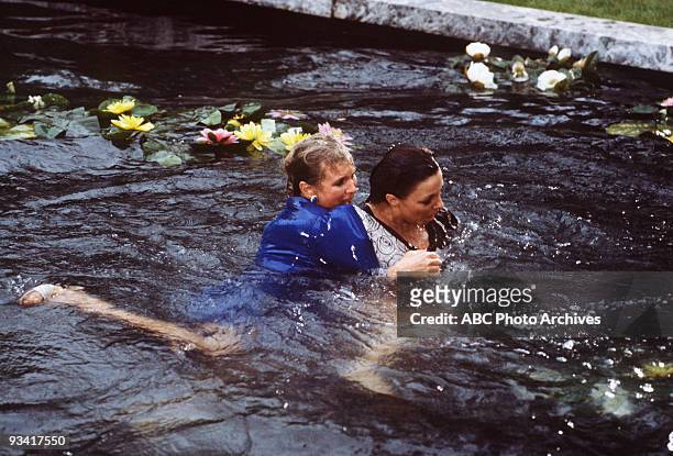 The Threat" - Season Three - 4/13/83, Krystle and Alexis's argument about Fallon resulted in a brawl in the Carrington lily pond.,