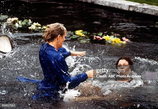 The Threat" - Season Three - 4/13/83, Krystle and Alexis's argument about Fallon resulted in a brawl in the Carrington lily pond.,