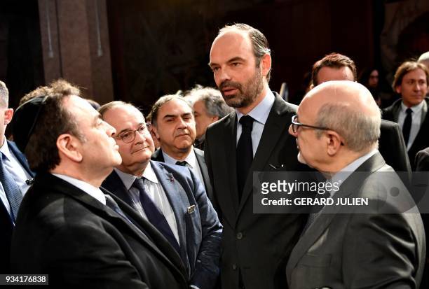 French Prime Minister Edouard Philippe speaks with President of the Israelite Central Consistory of France Joel Mergui and CRIF president Francis...