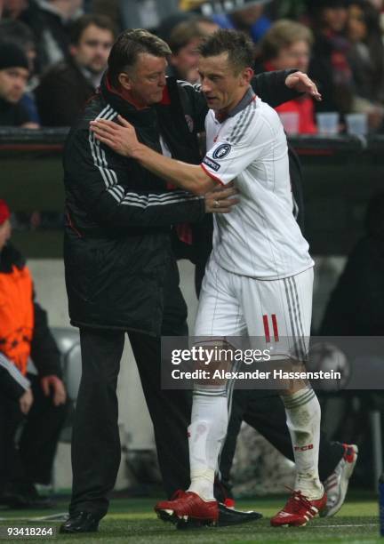 Coach Louis van Gaal congratulates Ivica Olic of Bayern Muenchen during the UEFA Champions League Group A match between FC Bayern Muenchen and...