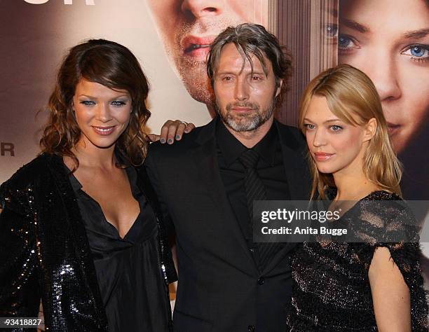 Actress Jessica Schwarz, actor Mads Mikkelsen and actress Heike Makatsch arrive at the Germany film premiere of 'Die Tuer' at Kulturbrauerei on...