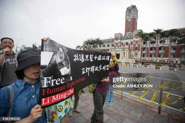 Activists take part in a demonstration in front of the Presidential Palace during the Commemorating Lee Ming-Ches One Year Of Imprisonment Protest...