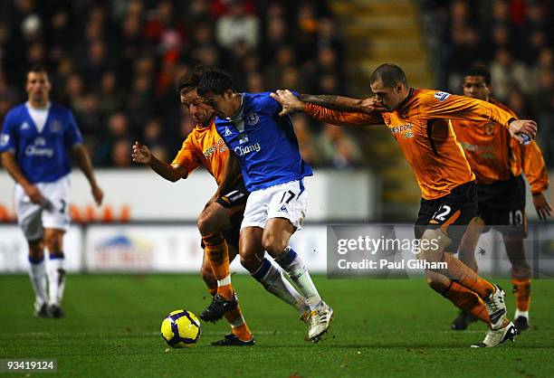 Tim Cahill of Everton battles for the ball with Stephen Hunt and Dean Marney of Hull City during the Barclays Premier League match between Hull City...