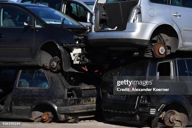 Crushed cars, including Audi and Volkswagen diesel EURO 4 cars stand crushed at a scrap yard on March 19, 2018 in Hamburg, Germany. Diesel car owners...