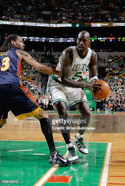 Kevin Garnett of the Boston Celtics drives the ball against Mikki Moore of the Golden State Warriors during the game on November 18, 2009 at TD...