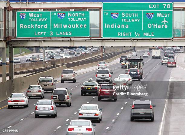 Traffic moves along the Kennedy Expressway in Chicago, Illinois, U.S., on Wednesday, Nov. 25, 2009. Millions of Americans got an early jump on their...