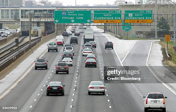 Traffic moves along the Kennedy Expressway in Chicago, Illinois, U.S., on Wednesday, Nov. 25, 2009. Millions of Americans got an early jump on their...