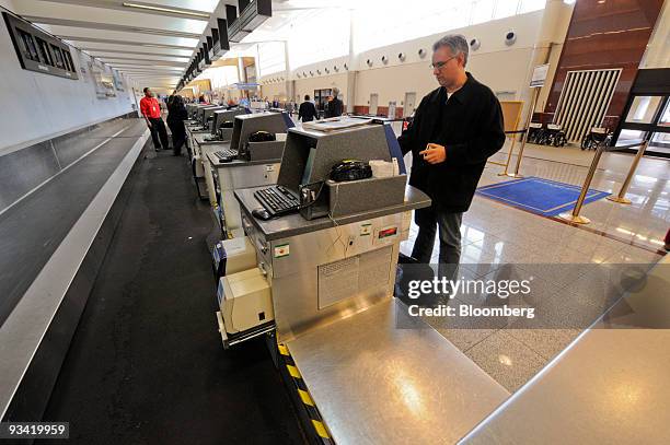 David Honicky checks in alone at the Continental Airlines counter at Hartsfield Jackson Internation Airport in Atlanta, Georgia, U.S. On Wednesday,...