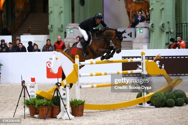 Marc HOUTZAGER and Sterrehof's Edinus competes in the Prix du 24 Faubourg CSI5* of Le Saut Hermes 2018 at Grand Palais on March 17, 2018 in Paris,...