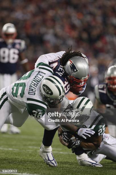 Running Back Laurence Maroney of the New England Patriots is stopped by Safety Jim Leonhard and Safety Kerry Rhodes of the New York Jets when the New...