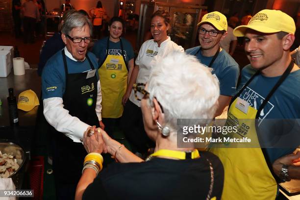 Ronni Kahn CEO and founder of OzHarvest greets Bloomberg Global Chairman Peter Grauer during the Oz Harvest CEO Cookoff on March 19, 2018 in Sydney,...