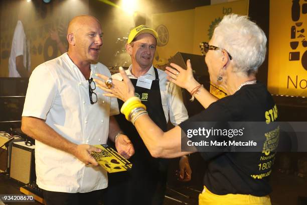 Ronni Kahn CEO and founder of OzHarvest greets Chef Matt Moran during the Oz Harvest CEO Cookoff on March 19, 2018 in Sydney, Australia.