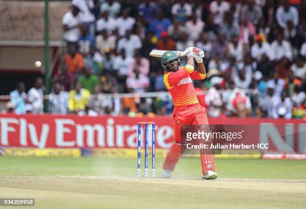 Solomon Mire of Zimbabwe hits out during The Cricket World Cup Qualifier between The West Indies and Zimbabwe at The Harare Sports Club on March 19,...