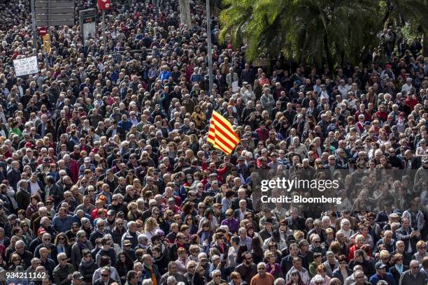 Protester waves a Catalan flag during the 'Marea Pensionista' demonstration for pension reform on Urquinaona Square in Barcelona, Spain, on Saturday,...