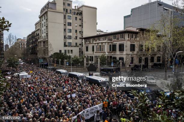 Police vans line the street during the 'Marea Pensionista' demonstration for pension reform in Barcelona, Spain, on Saturday, March 17, 2017. As...