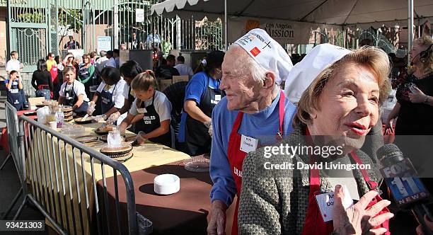Actor Kirk Douglas and wife Anne Douglas attend the Los Angeles Mission & Anne Douglas Center's Thanksgiving Meal for the Homeless on November 25,...