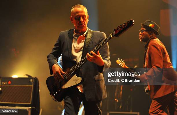 Horace Panter and Lynval Golding of The Specials perform on stage at Hammersmith Apollo on November 25, 2009 in London, England.