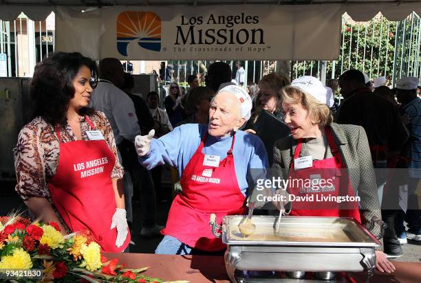 Host Michaela Pereira, actor Kirk Douglas and wife Anne Douglas attend the Los Angeles Mission & Anne Douglas Center's Thanksgiving Meal for the...