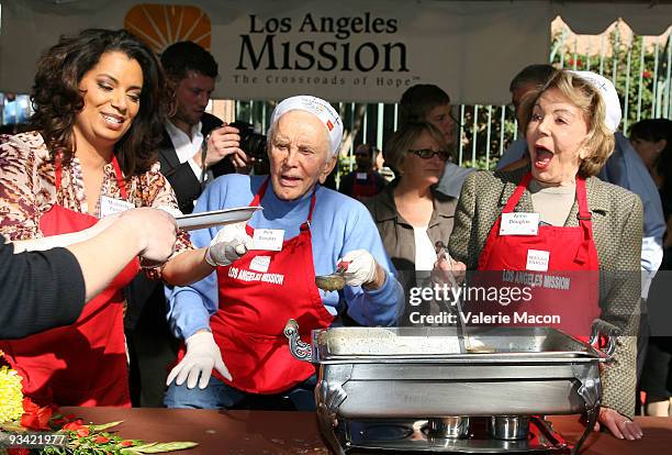 Michaela Pereira , actor Kirk Douglas and Anne Douglas attends the Los Angeles Mission Thanksgiving meal for the homeless at Los Angeles Mission on...