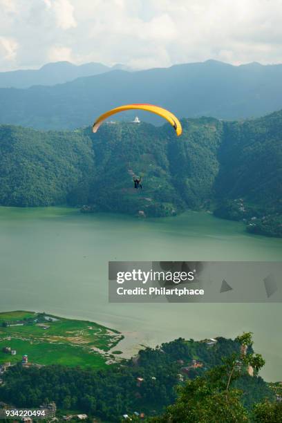 scenic view at pokhara lake mountain range and paraglider - nepal pokhara stock pictures, royalty-free photos & images