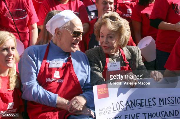Actor Kirk Douglas and wife Anne attends the Los Angeles Mission Thanksgiving meal for the homeless at Los Angeles Mission on November 25, 2009 in...