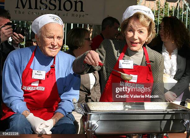 Actor Kirk Douglas and wife Anne attends the Los Angeles Mission Thanksgiving meal for the homeless at Los Angeles Mission on November 25, 2009 in...