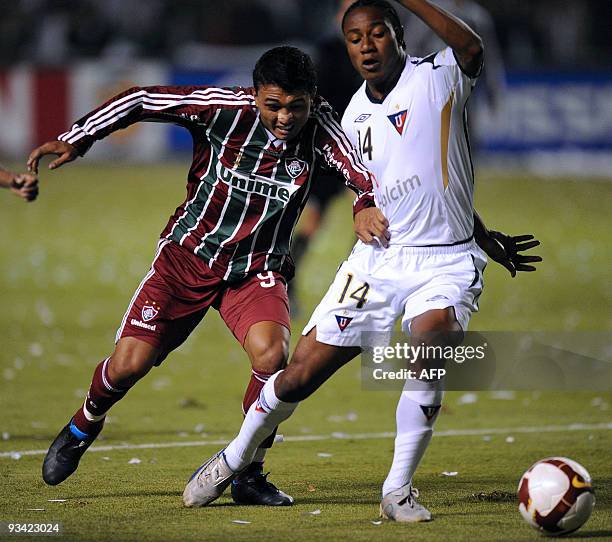 Brazilian Fluminense's Kieza vies for the ball with Ecuadorean Liga Deportiva Universitaria de Quito's Diego Calderon during their Copa Sudamericana...