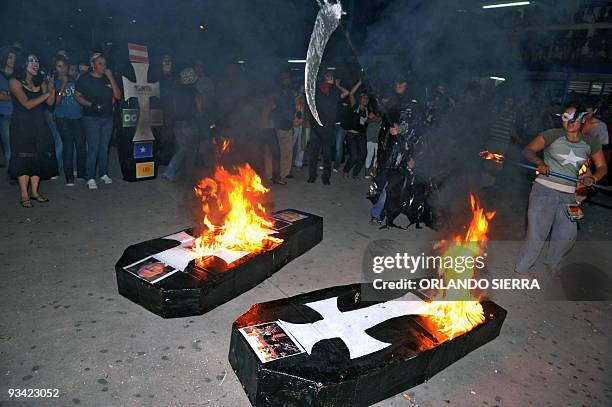 Honduran University students burn coffins with the pictures of Honduran de facto leader Roberto Micheletti, Armed Forces Chief, general Romeo...