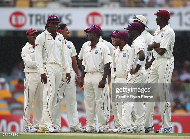 Chris Gayle of the West Indies gathers his team during day one of the First Test match between Australia and the West Indies at The Gabba on November...