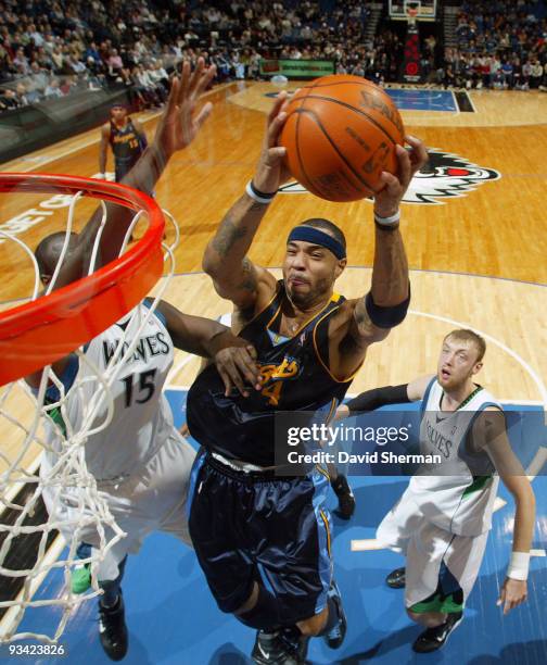 Kenyon Martin of the Denver Nuggets goes to the basket against Nathan Jawai of the Minnesota Timberwolves during the game on November 25, 2009 at the...