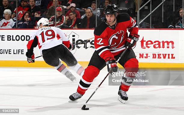 Rookie Matthew Corrente of the New Jersey Devils controls the puck against the Ottawa Senators at the Prudential Center on November 25, 2009 in...