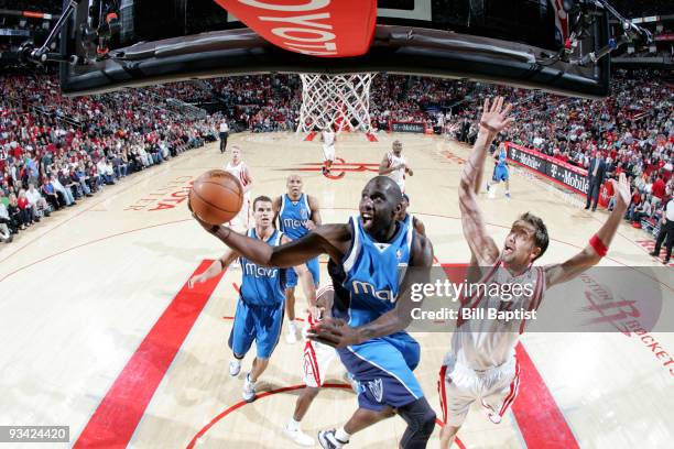 Tim Thomas of the Dallas Mavericks shoots the ball over David Anderson of the Houston Rockets on November 25, 2009 at the Toyota Center in Houston,...