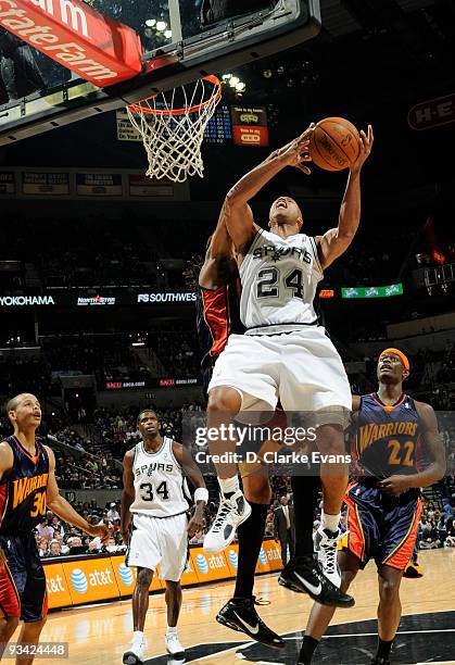 Richard Jefferson of the San Antonio Spurs shoots against Mikki Moore of the Golden State Warriors on November 25, 2009 at the AT&T Center in San...