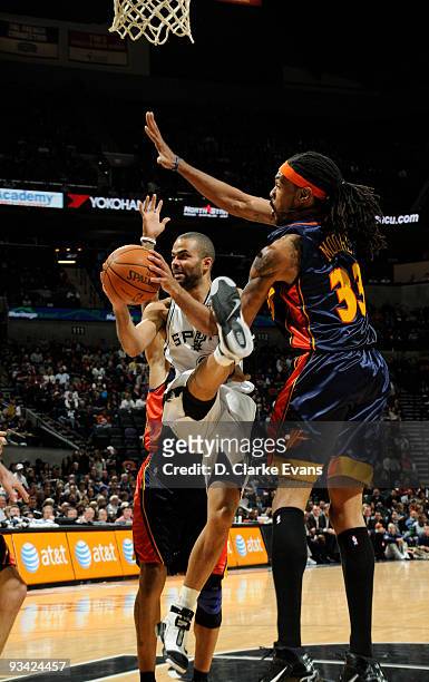 Tony Parker of the San Antonio Spurs shoots a layup against Mikki Moore of the Golden State Warriors on November 25, 2009 at the AT&T Center in San...