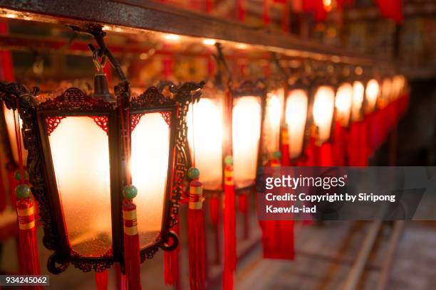 row of the chinese style lanterns at man mo temple, hong kong. - copyright by siripong kaewla iad stock pictures, royalty-free photos & images