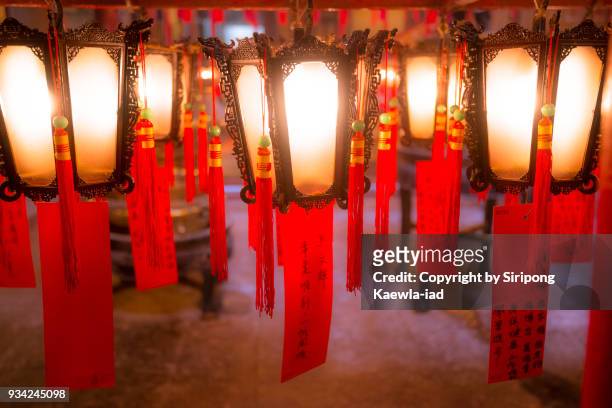 close up of the chinese style lanterns abreast hang at man mo temple, hong kong. - copyright by siripong kaewla iad stock pictures, royalty-free photos & images