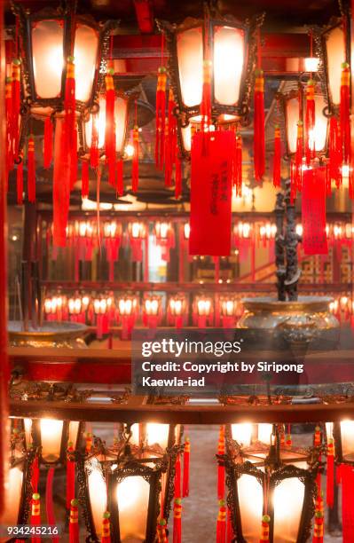 top and bottom row of the chinese style lanterns at man mo temple, hong kong. - copyright by siripong kaewla iad stock pictures, royalty-free photos & images