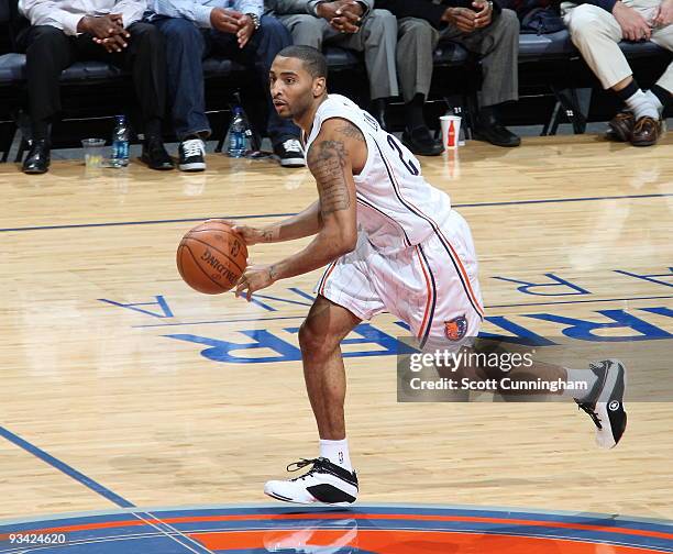 Acie Law of the Charlotte Bobcats drives against the Toronto Raptors on November 25, 2009 at the Time Warner Cable Arena in Charlotte, North...