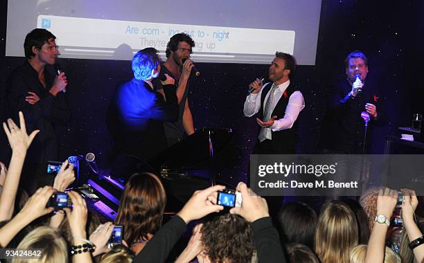 Jason Orange, Mark Owen, Howard Donald and Gary Barlow of Take That and actor James Corden attend the SingStar Take That Extravaganza at the...