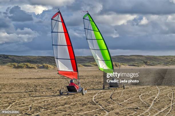 four kite racers - man snow wind stock pictures, royalty-free photos & images