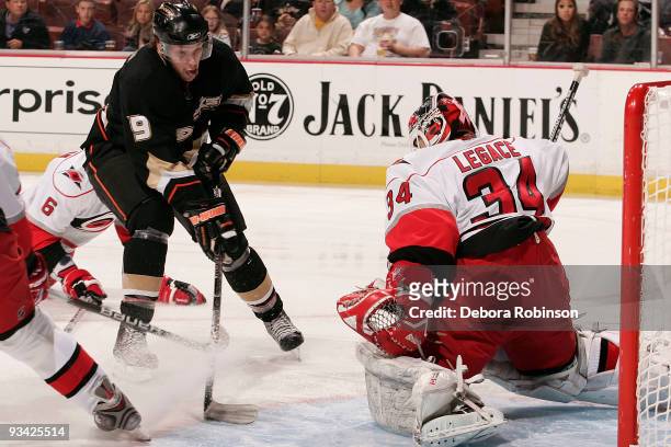 Manny Legace of the Carolina Hurricanes defends in the crease from a shot from Bobby Ryan of the Anaheim Ducks during the game on November 25, 2009...
