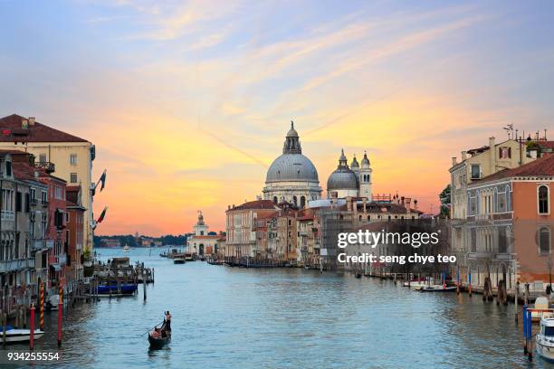 gondola in the grand canal at sunset - venice stock pictures, royalty-free photos & images