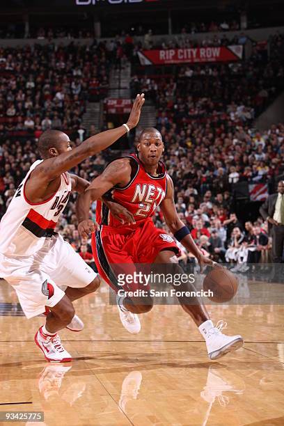 Bobby Simmons of the New Jersey Nets drives against Dante Cunningham of the Portland Trail Blazers during a game on November 25, 2009 at the Rose...
